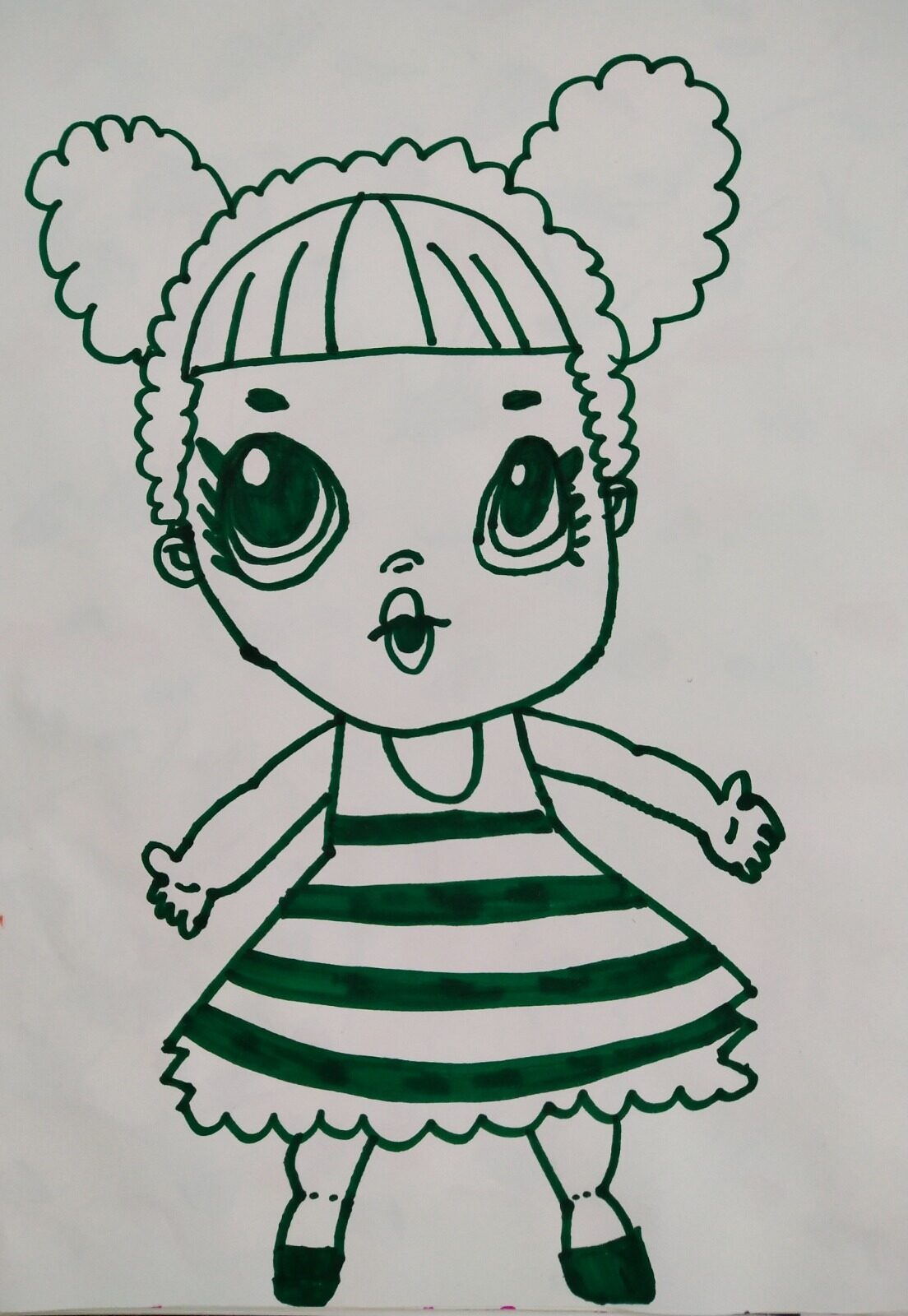 Green marker drawing of a girl with big eyes, curly bunches and a striped dress